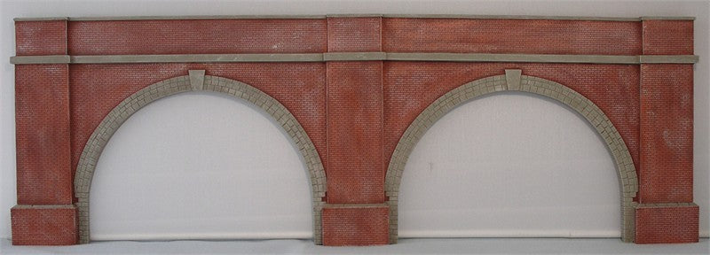 One piece casting of 2 open, narrow, low brick arches with buttresses UNPAINTED